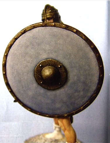 I found it easier to paint  the shield after attaching it to the figure.